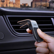 UGREEN LP290 80712B magnetic air vent car phone holder holding a phone while driving
