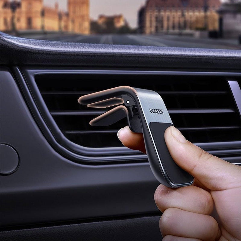 UGREEN LP290 80712B magnetic air vent car phone holder holding a phone while driving