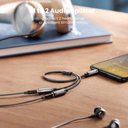 UGREEN AV123 10532 splitter sharing audio from one phone to two headphones