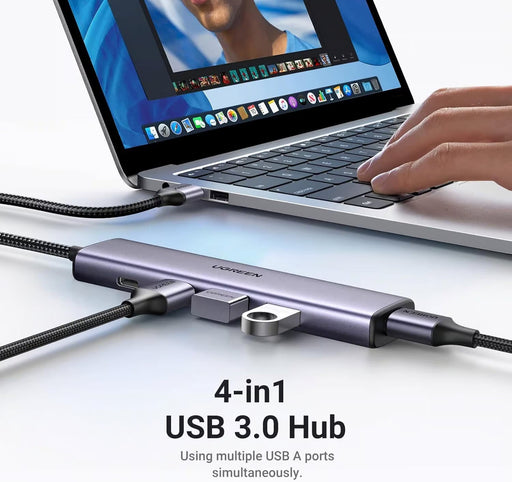 UGREEN 20805 hub connected to a laptop and USB peripherals