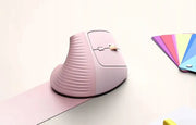 UGREEN 55917 pink vertical mouse beside a laptop