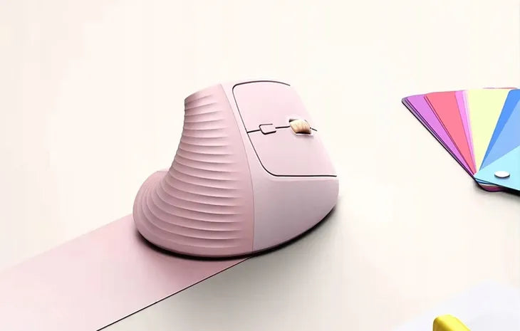 UGREEN 55917 pink vertical mouse beside a laptop